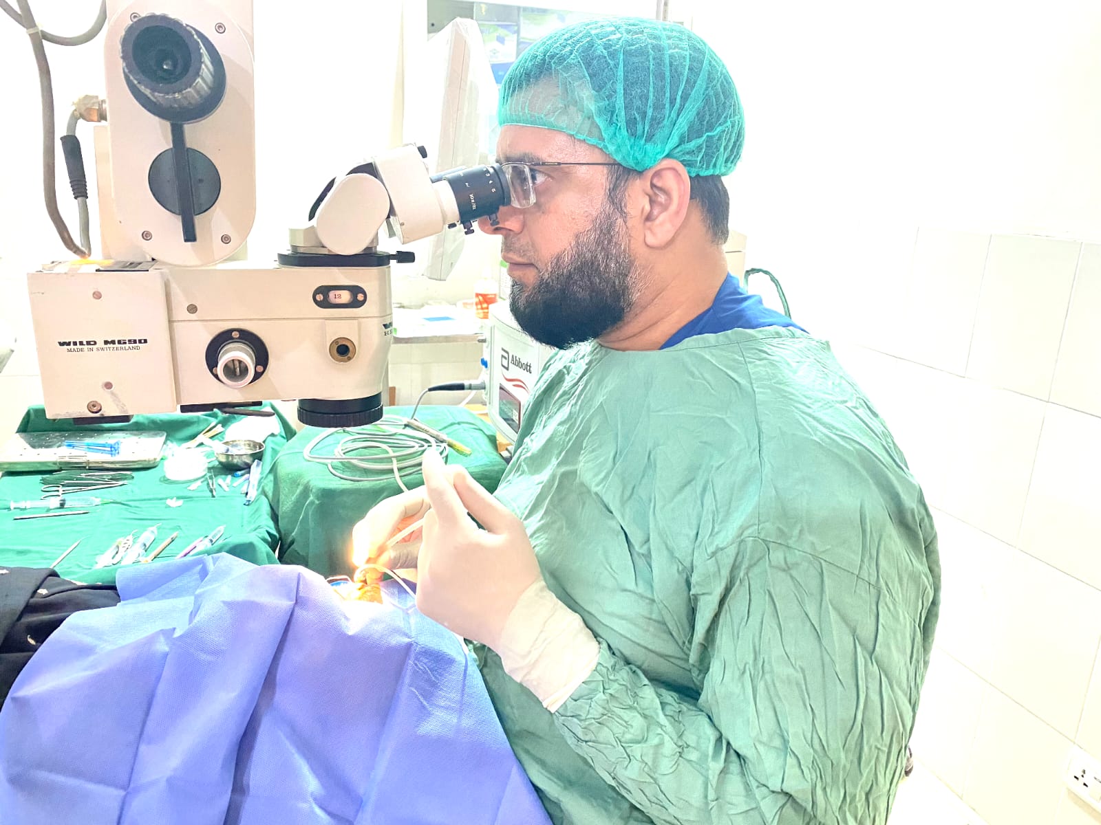 NOVA Eye Centre surgeon performing cataract surgery at the operating microscope